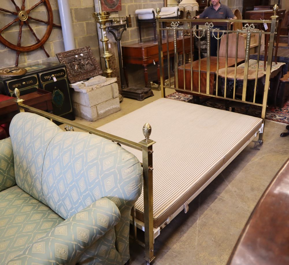 An Edwardian brass 4ft. 6in. bedframe